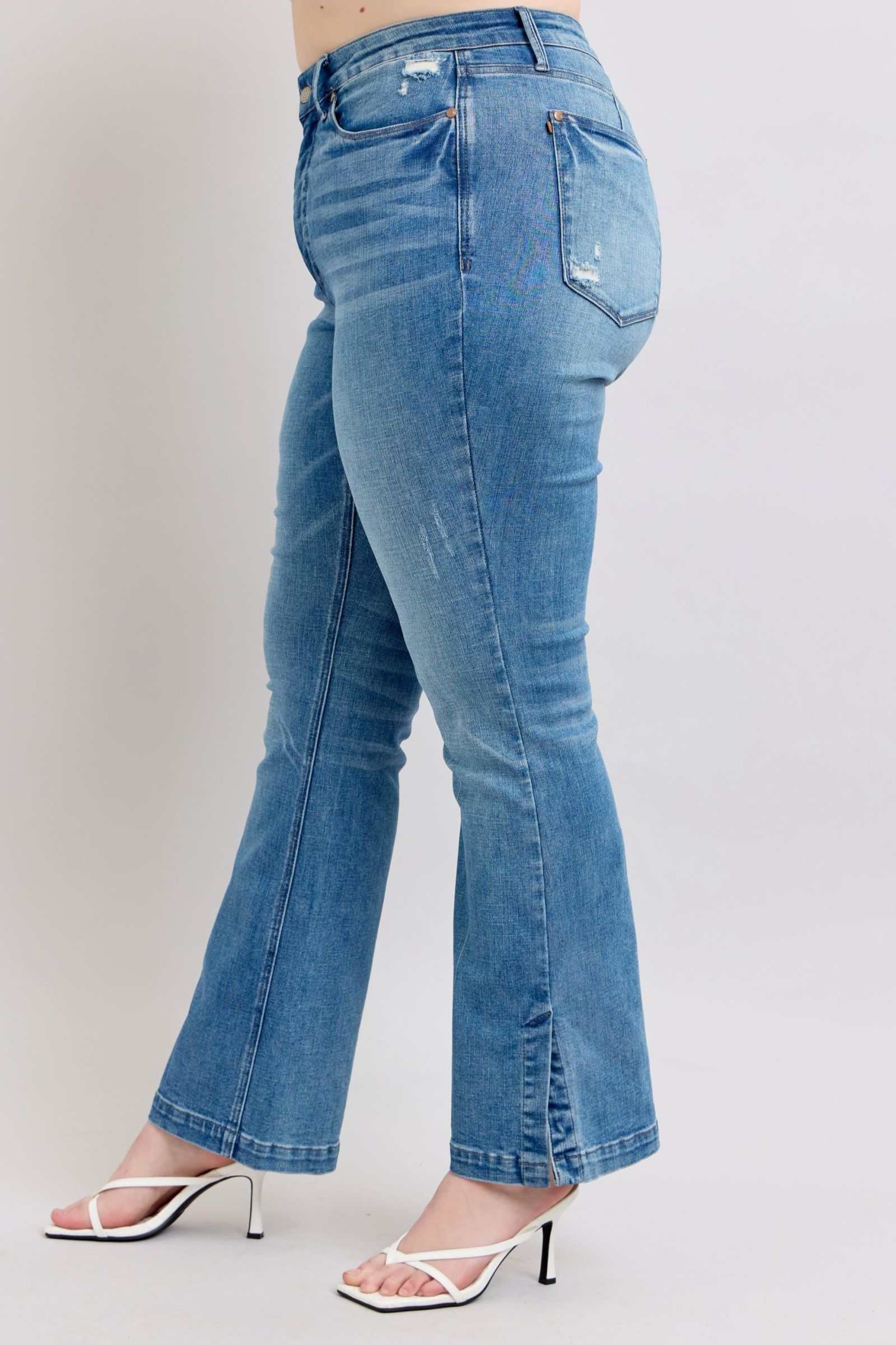 Judy Blue HW high-waisted slim bootcut jeans with vintage wash and side slit detail.