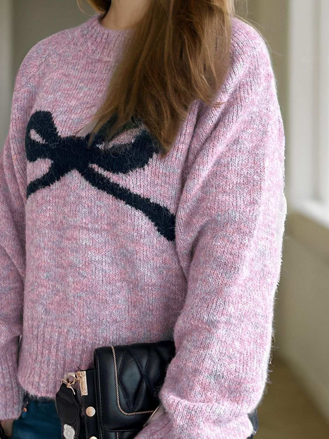 Bow Round Neck Long Sleeve Sweater in pink with bow design, slightly stretchy, polyester-acrylic blend.