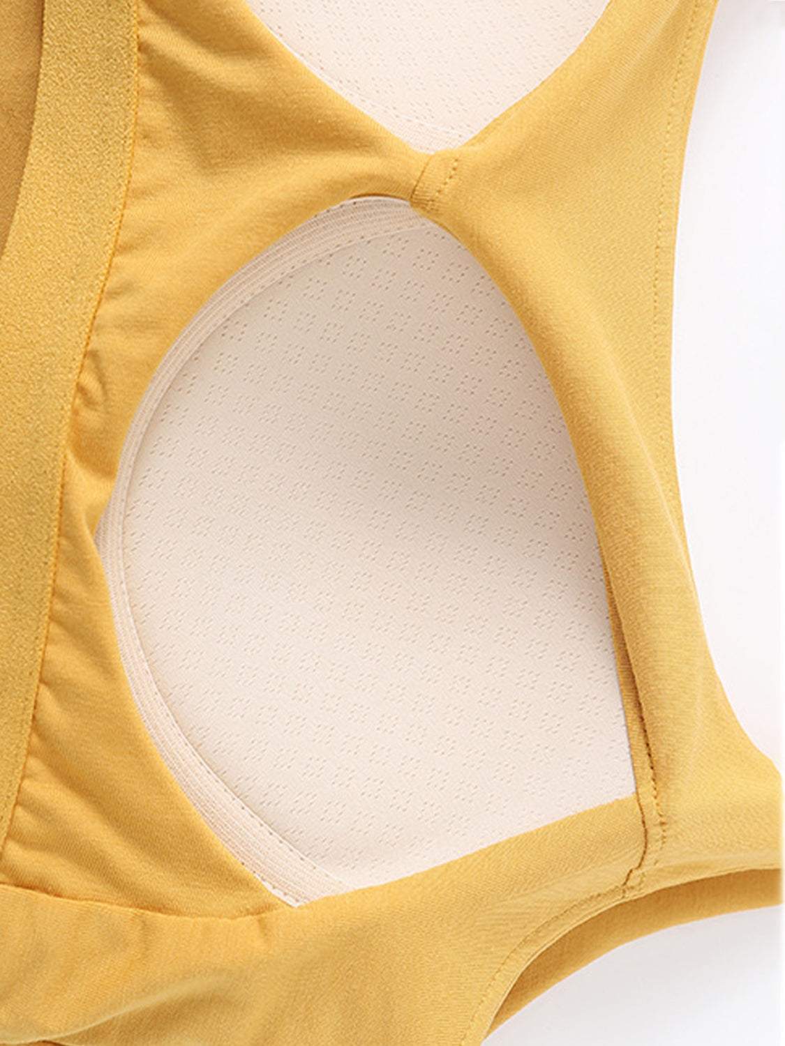Scoop neck cropped cami with chest pads in yellow fabric.