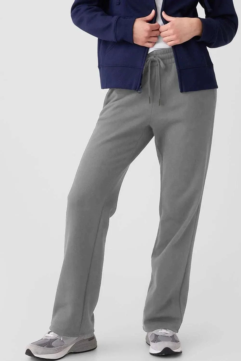 Gray drawstring pants with pockets, featuring polyester-cotton blend.
