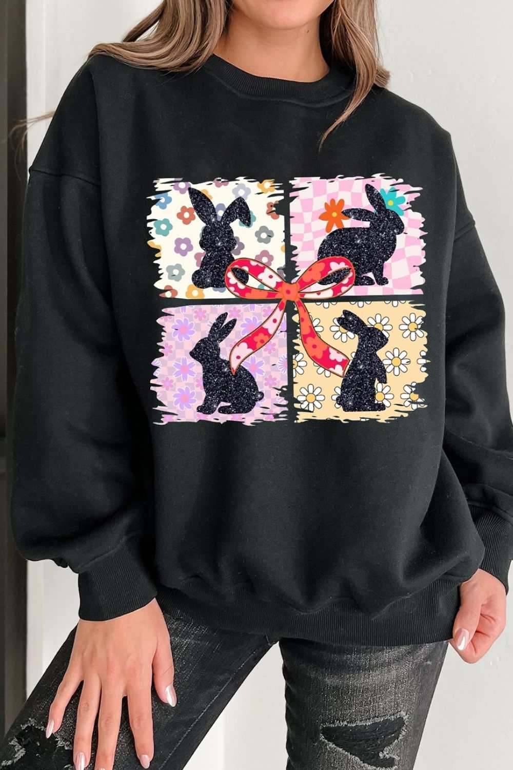 Black sweatshirt with floral bunny plaid bow graphic and slightly stretchy cotton polyester blend