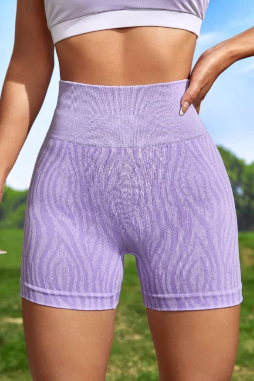 Wide waistband slim fit active shorts in solid lavender, sporty style, highly stretchy fabric.