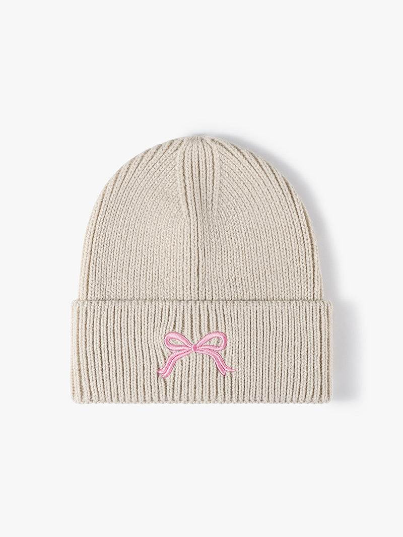 Embroidered Bow Knit Hat in beige acrylic with pink bow detail.
