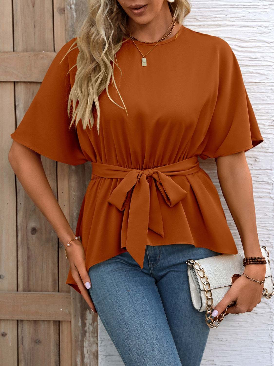 Ivy Lane tied round neck half sleeve blouse in rust color with waist tie and relaxed fit