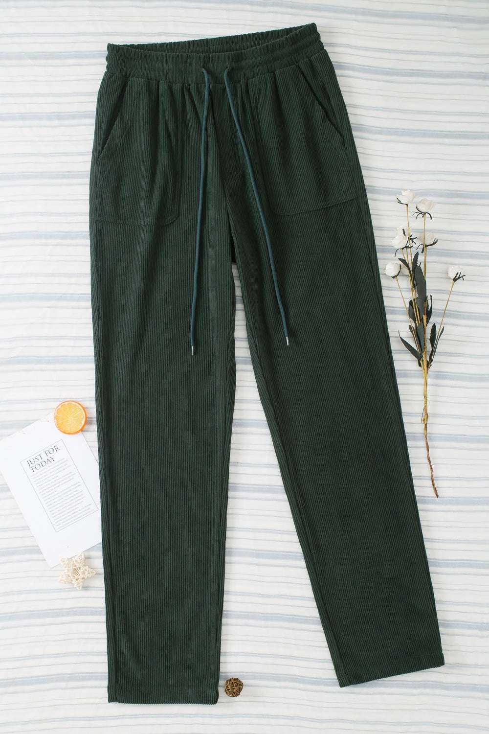 Drawstring straight pants with pockets, 100% polyester, dark green color.