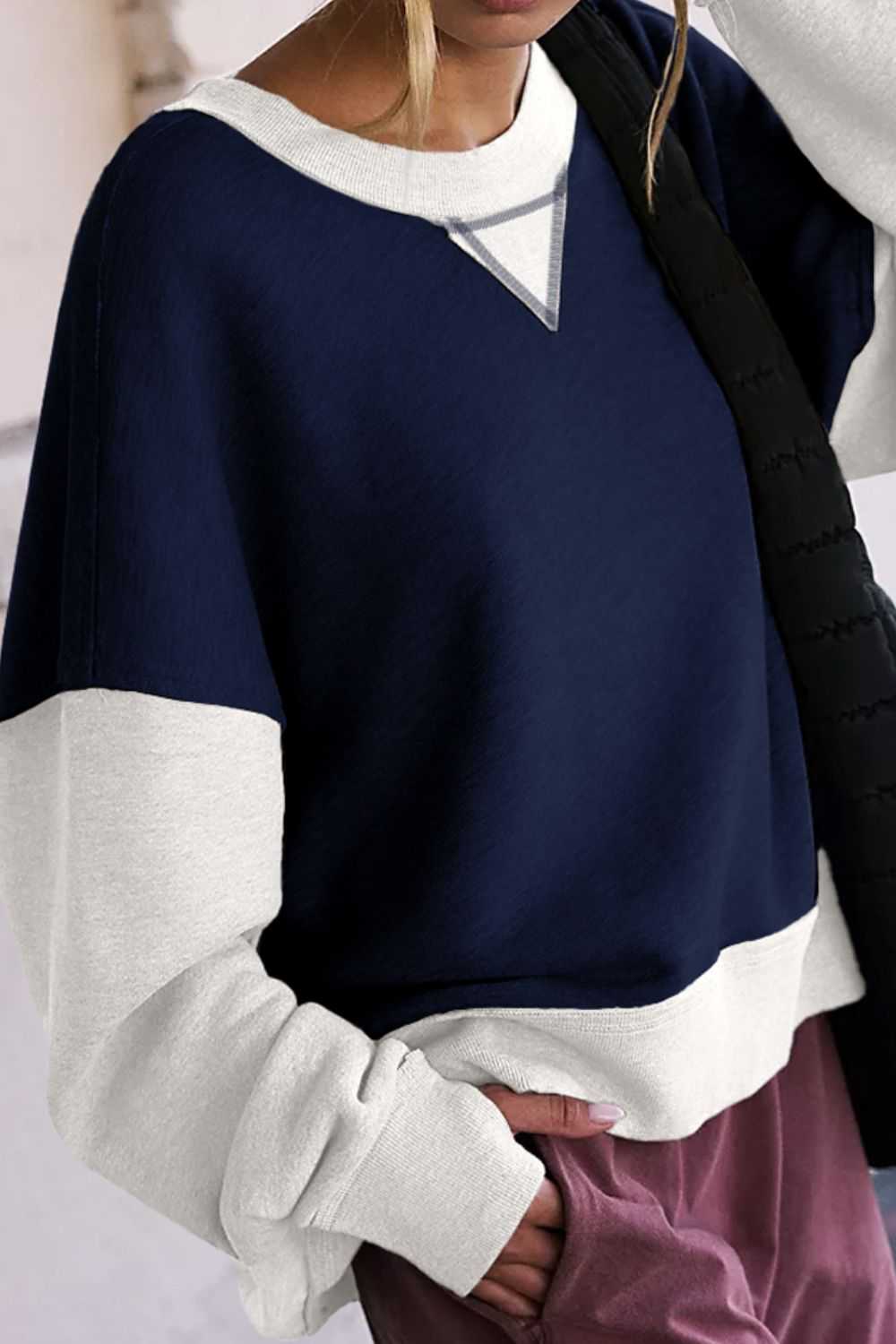 Contrast round neck long sleeve sweatshirt in navy and white, casual style.