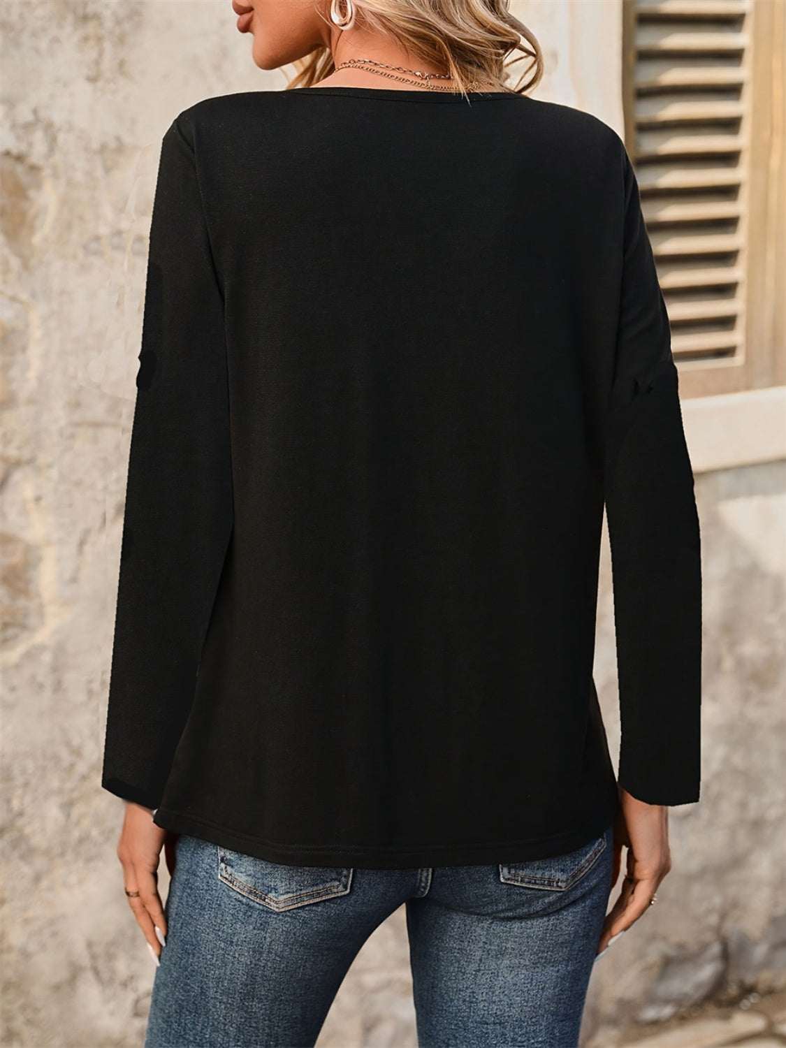 Notched long sleeve T-shirt with decorative button, black, slightly stretchy, polyester blend.