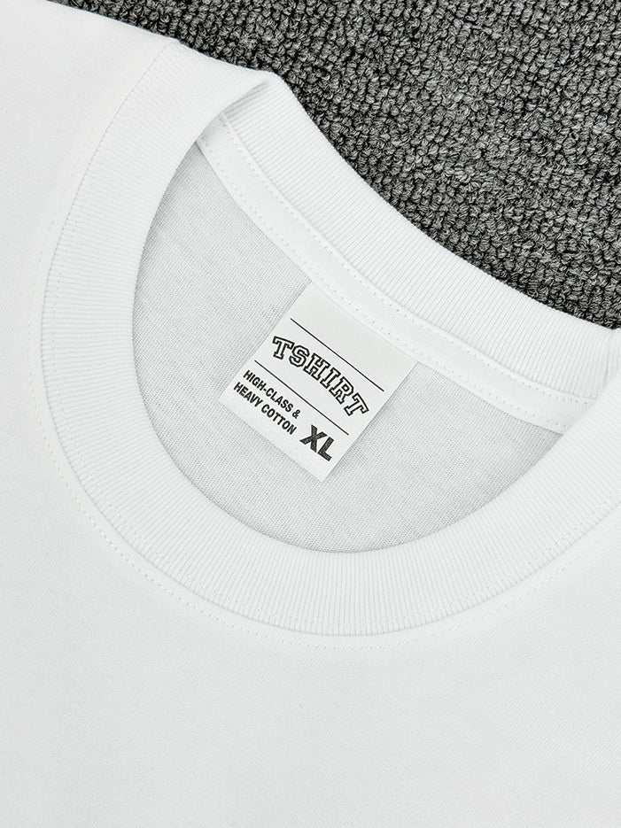 Men's round neck short sleeve white t-shirt on gray background, size XL.