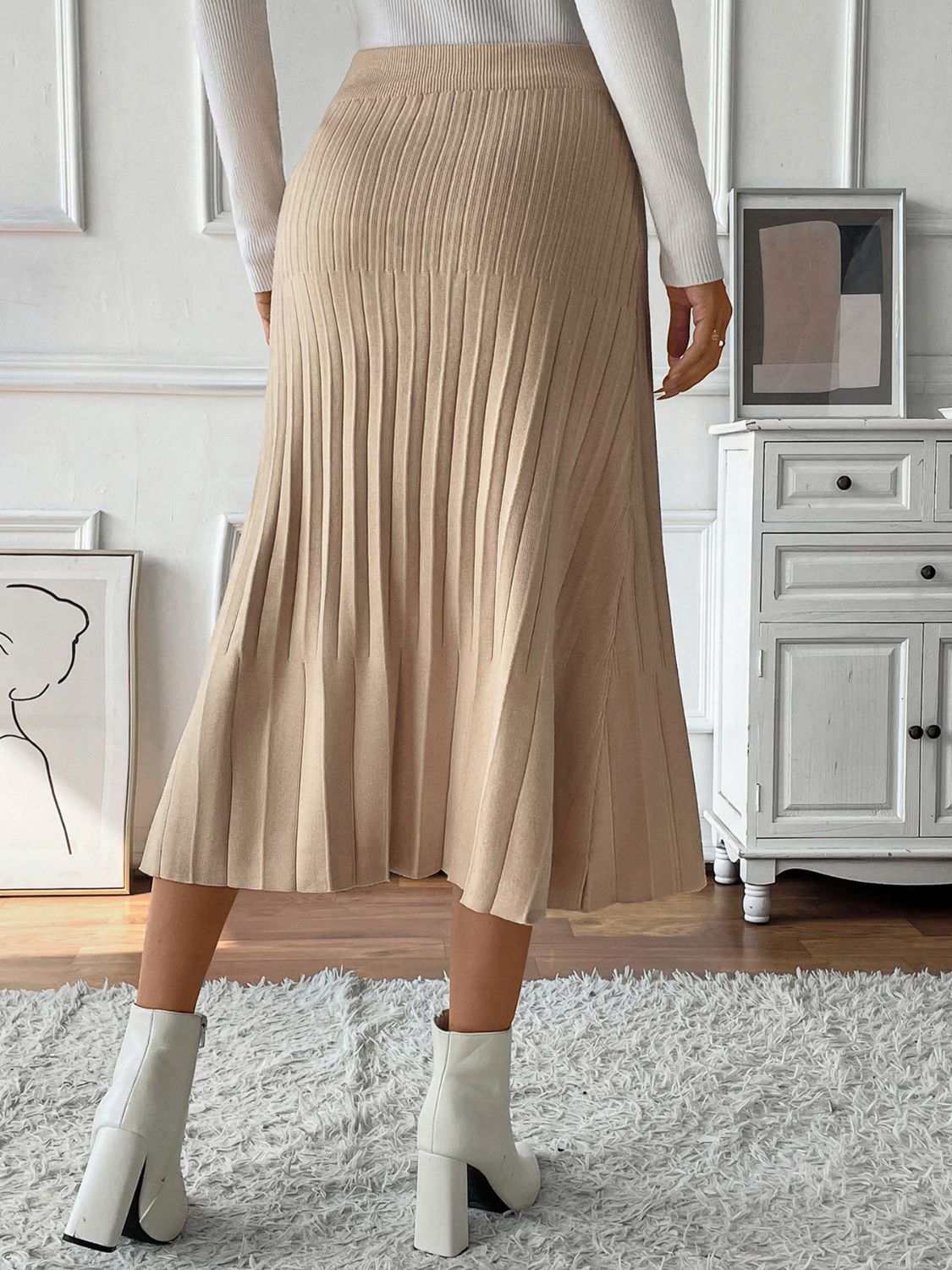Perfee Pleated Midi Sweater Skirt in beige, stretchy and machine washable, made of viscose, polyamide, and polyester.