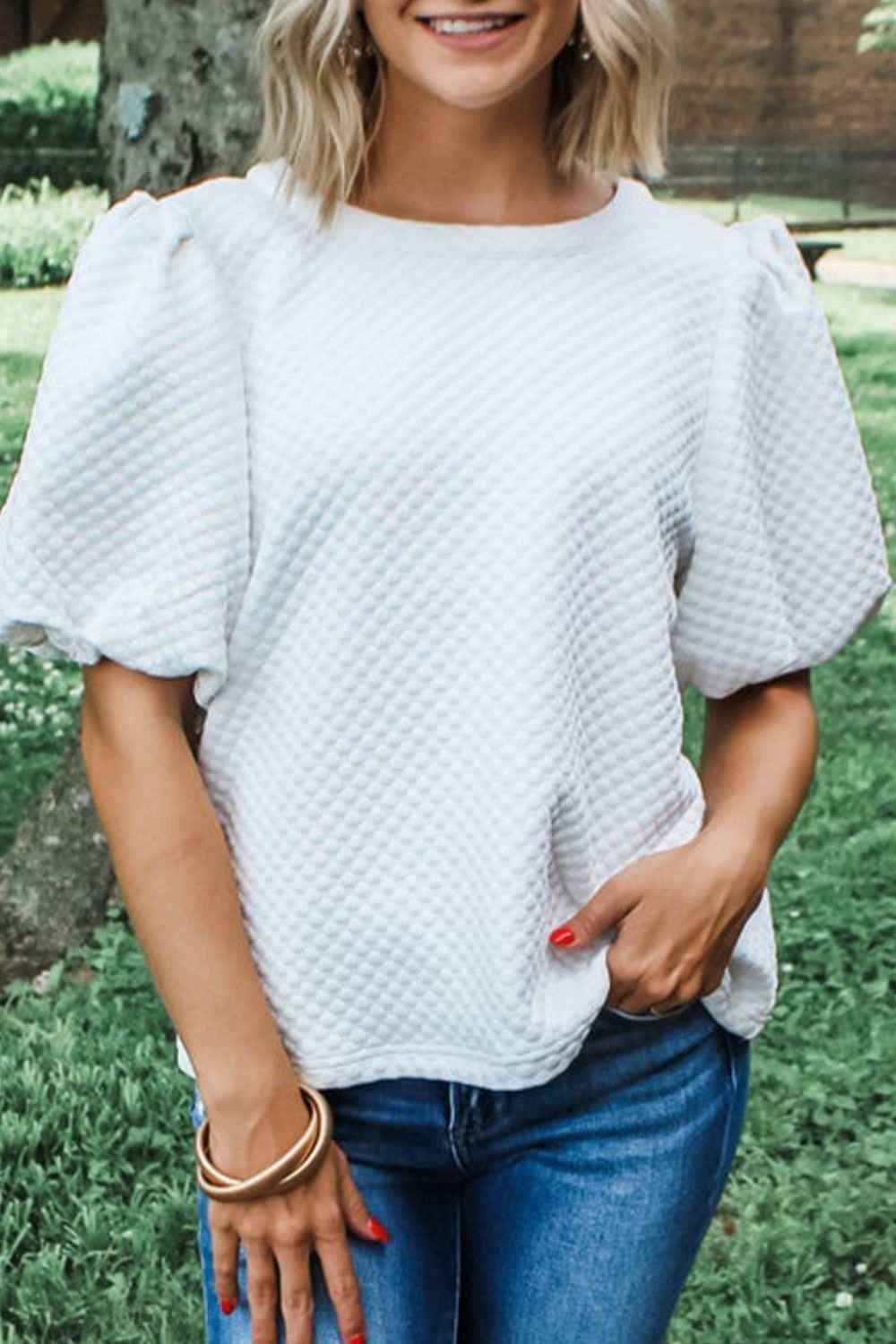 Textured round neck puff sleeve blouse in white, slightly stretchy fabric.