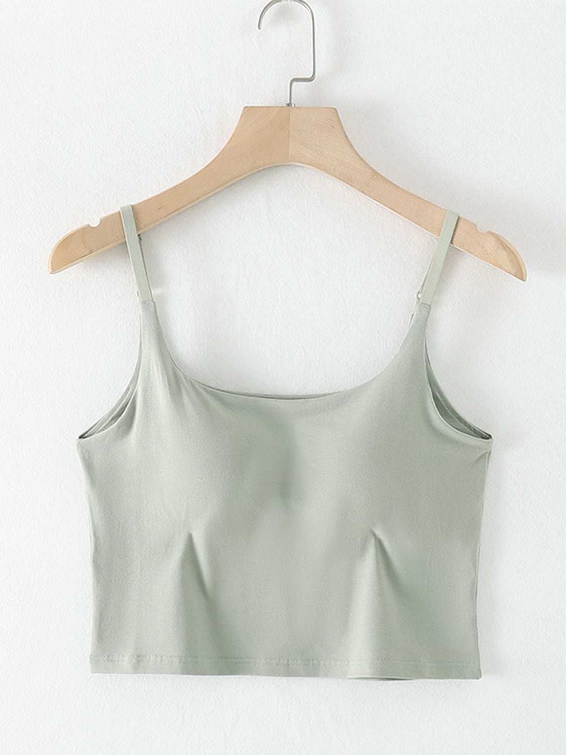 Cropped cami with scoop neck and chest pads on hanger.