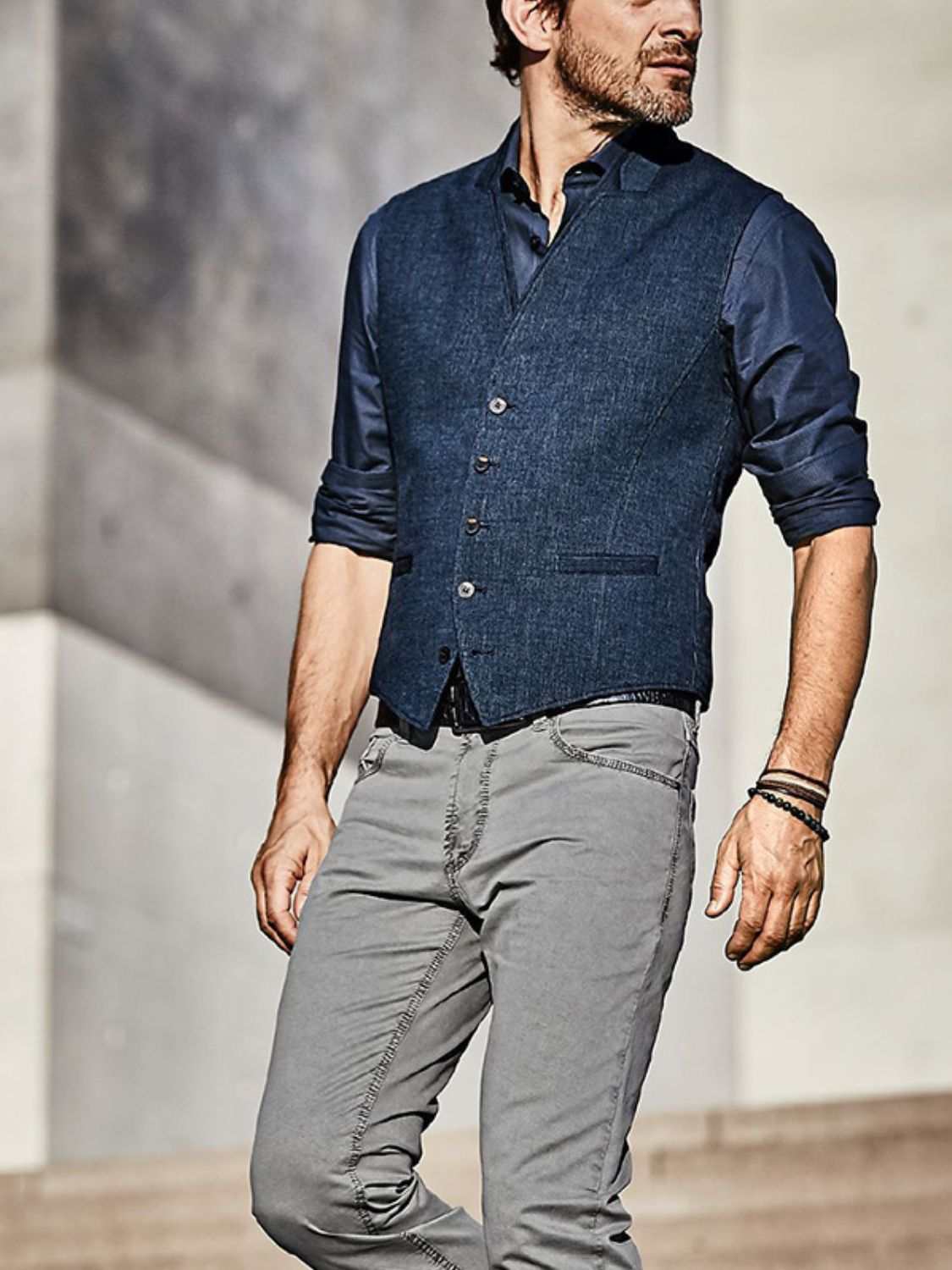 Men's full size button down vest, slightly stretchy, polyester-cotton blend.