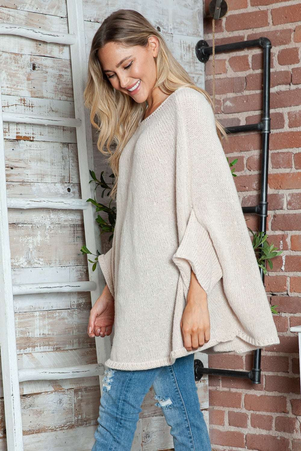Round neck batwing sleeve sweater in light beige, featuring a basic style and slightly stretchy polyester material.