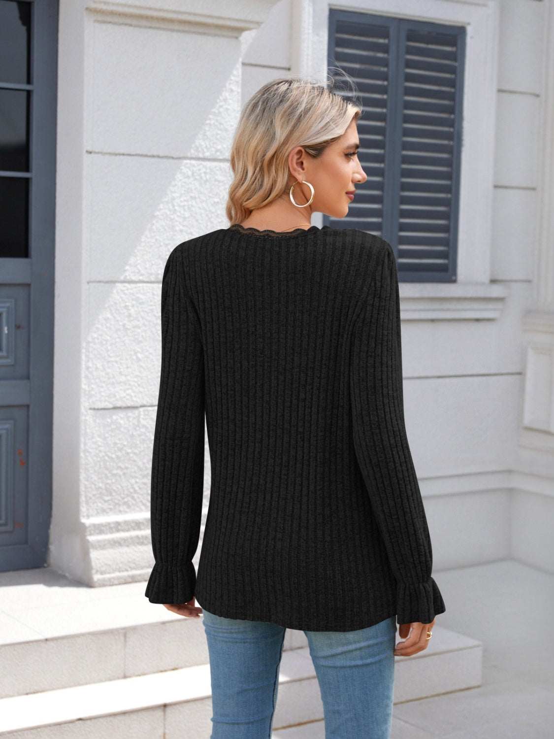 Lace detail V-neck long sleeve T-shirt in black with ruffled design, made of 100% polyester.