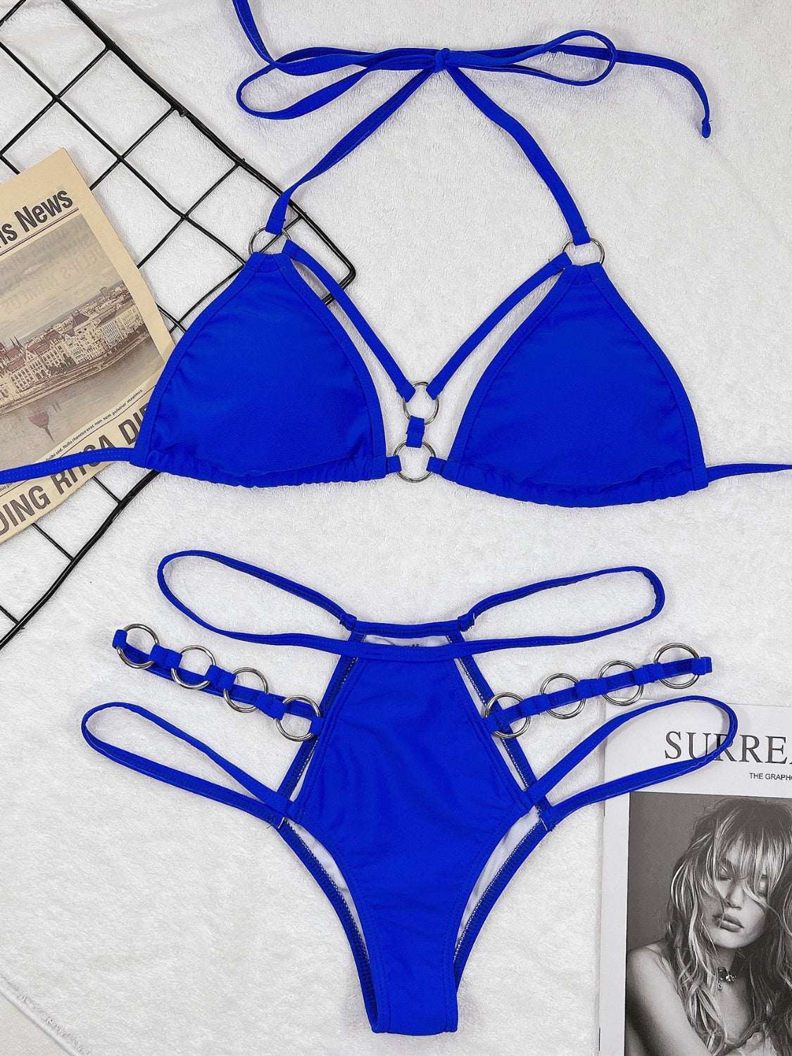 Cutout halter neck two-piece bikini set in blue with removable padding and no underwire.