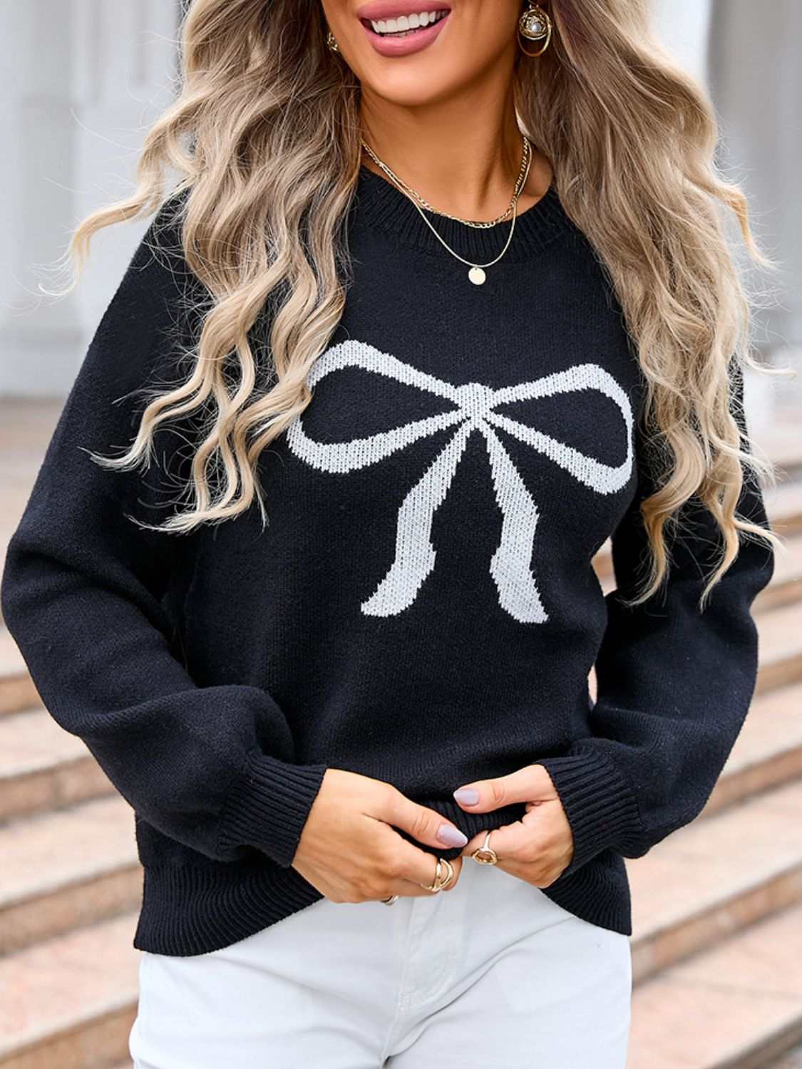 Angel Wings Bow Graphic Round Neck Long Sleeve Sweater with white bow design.