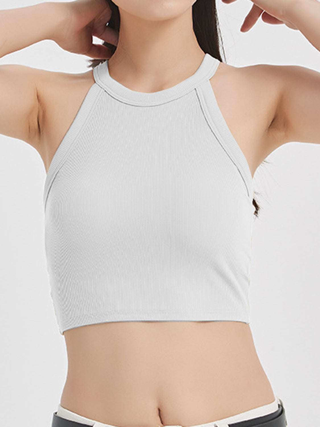 Ribbed Grecian neck cropped tank with chest pads in white.