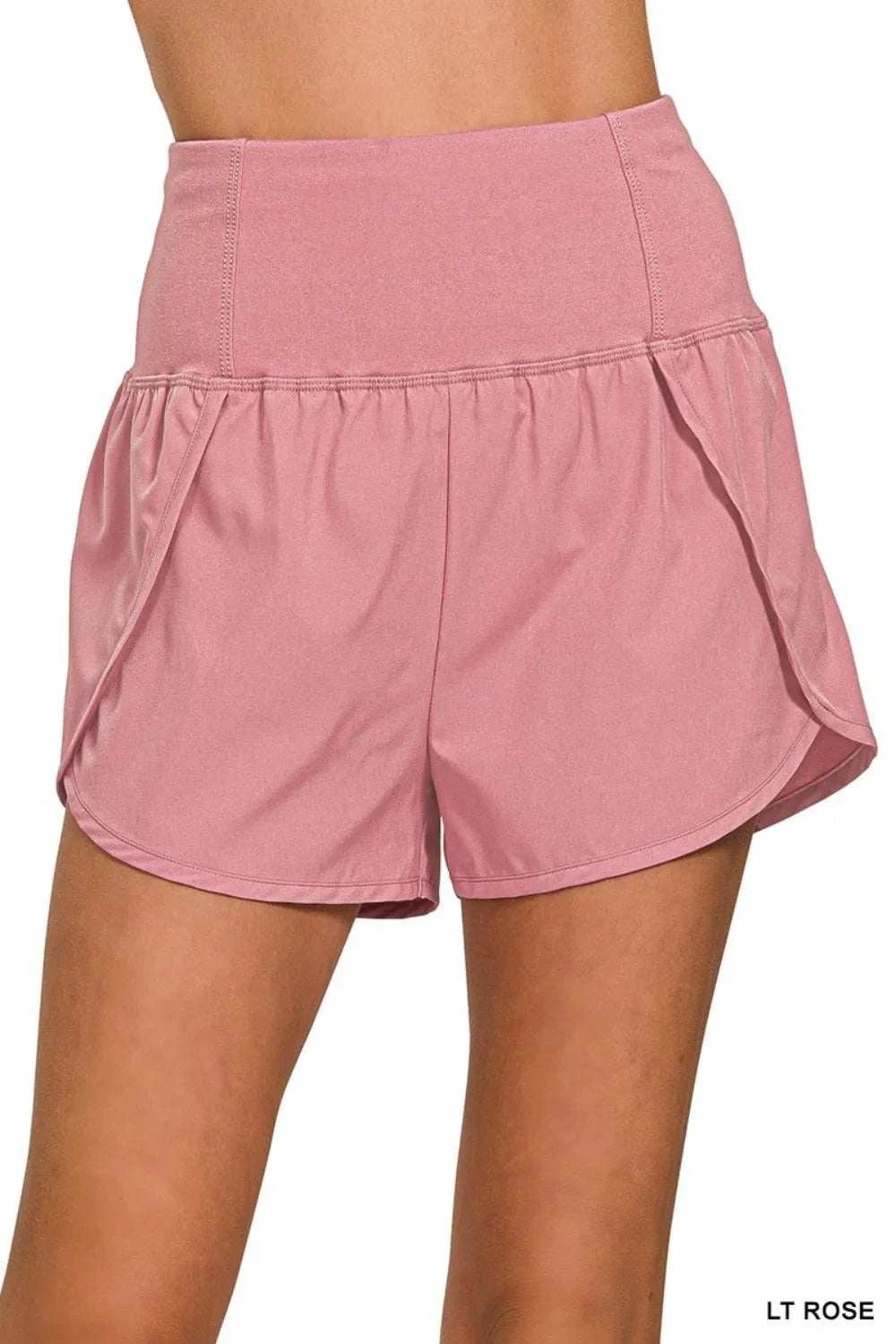 High waisted zippered back pocket running shorts in light rose color.