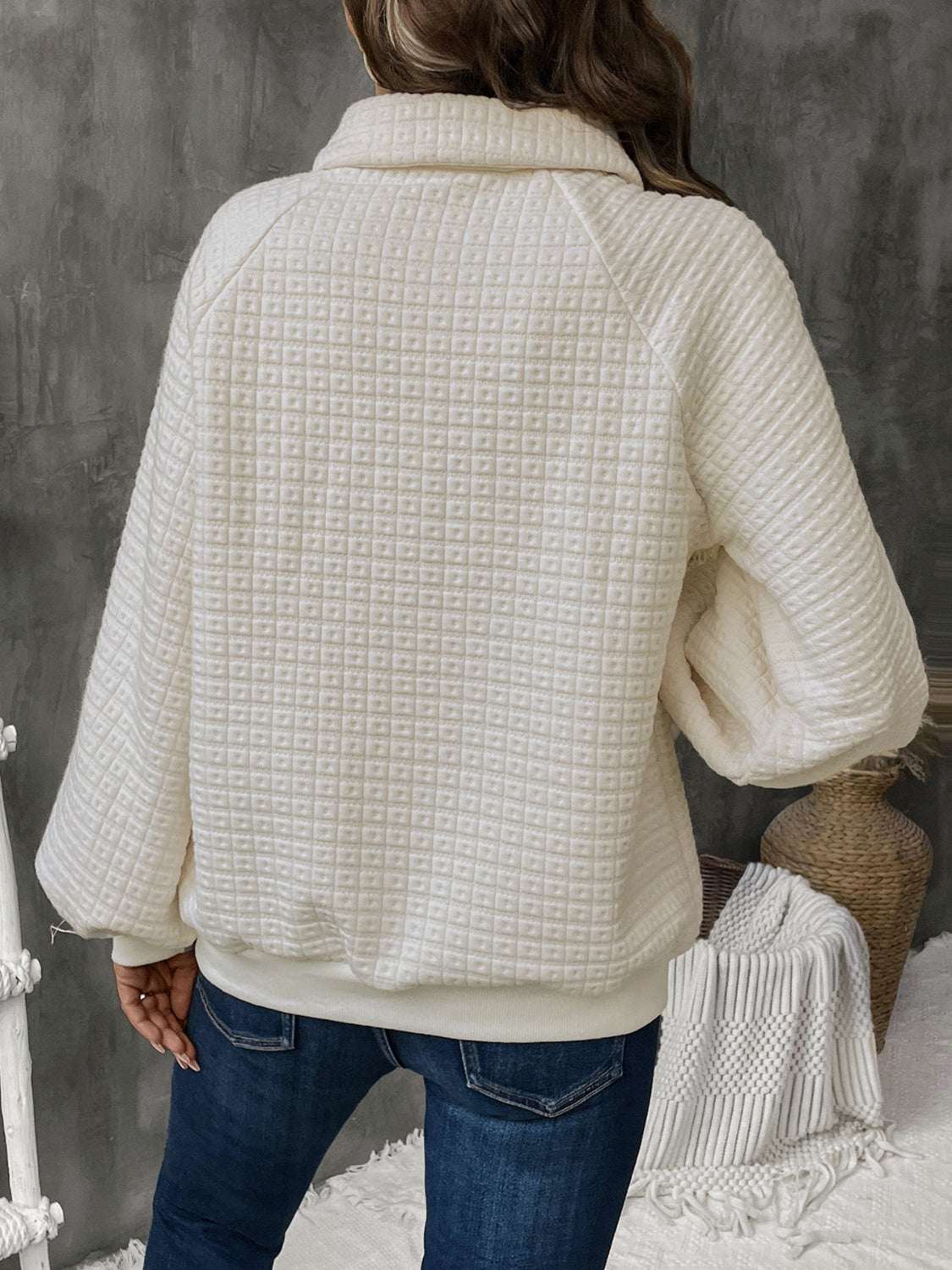 Perfee Half Button Long Sleeve Sweatshirt in white, featuring a textured design and a cozy fit.