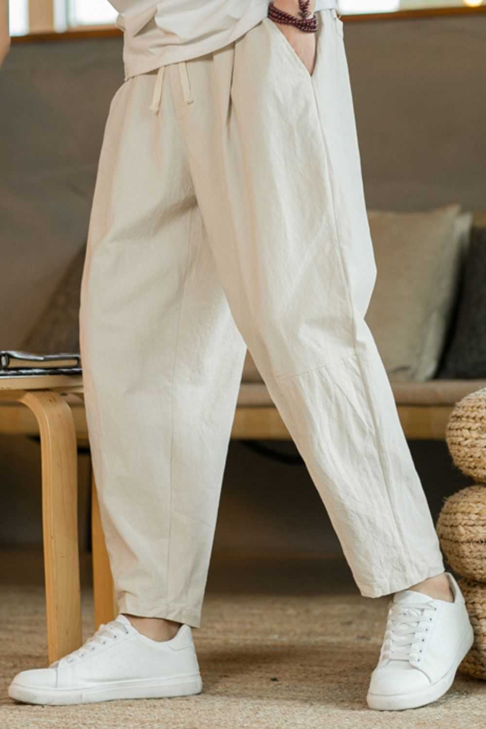 Plus size drawstring pants with pockets in beige color, made of cotton and flax, basic style.