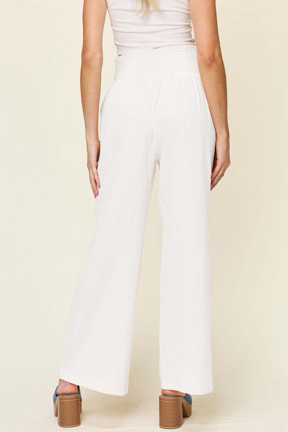 Double Take Full Size Texture Smocked Waist Wide Leg Pants in white, back view.