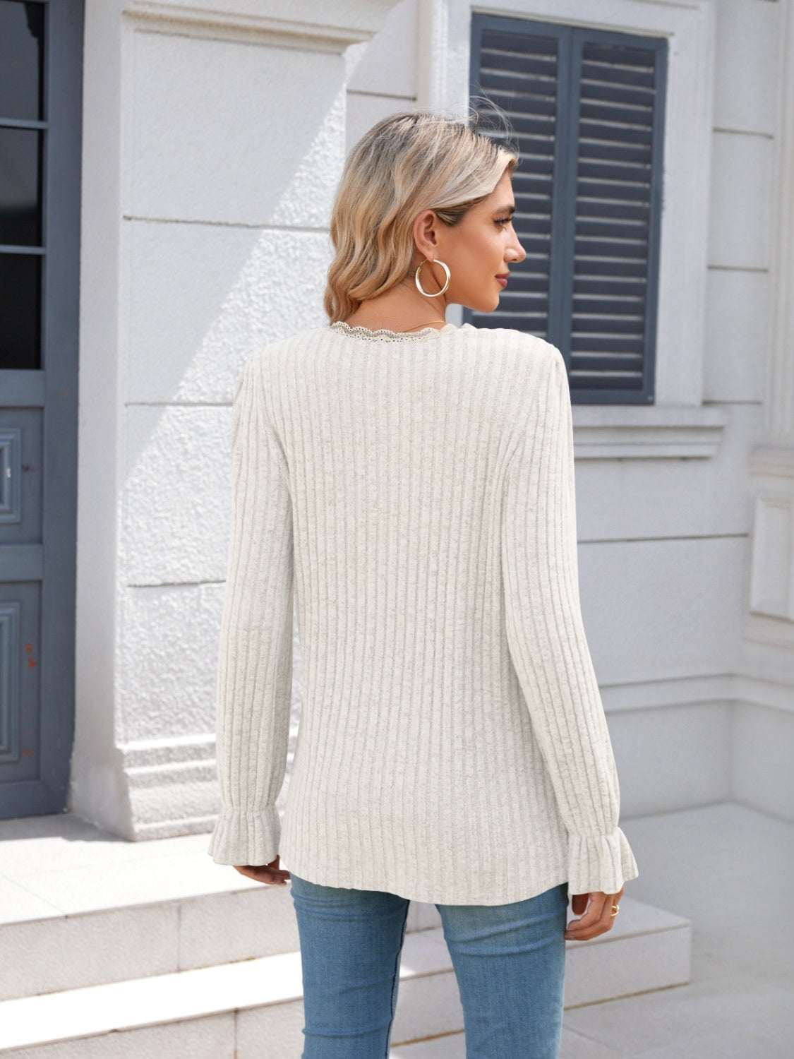 Lace detail V-neck long sleeve T-shirt with ruffled edges in white, back view.