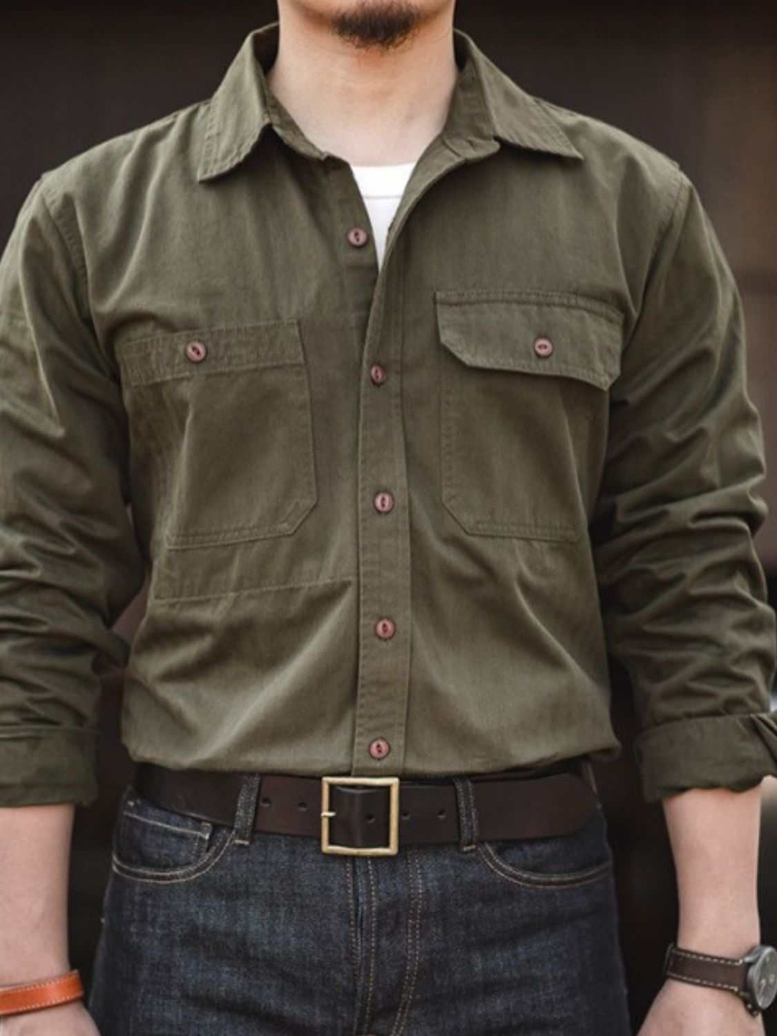 Men's button down long sleeve shirt with chest pockets in olive green.