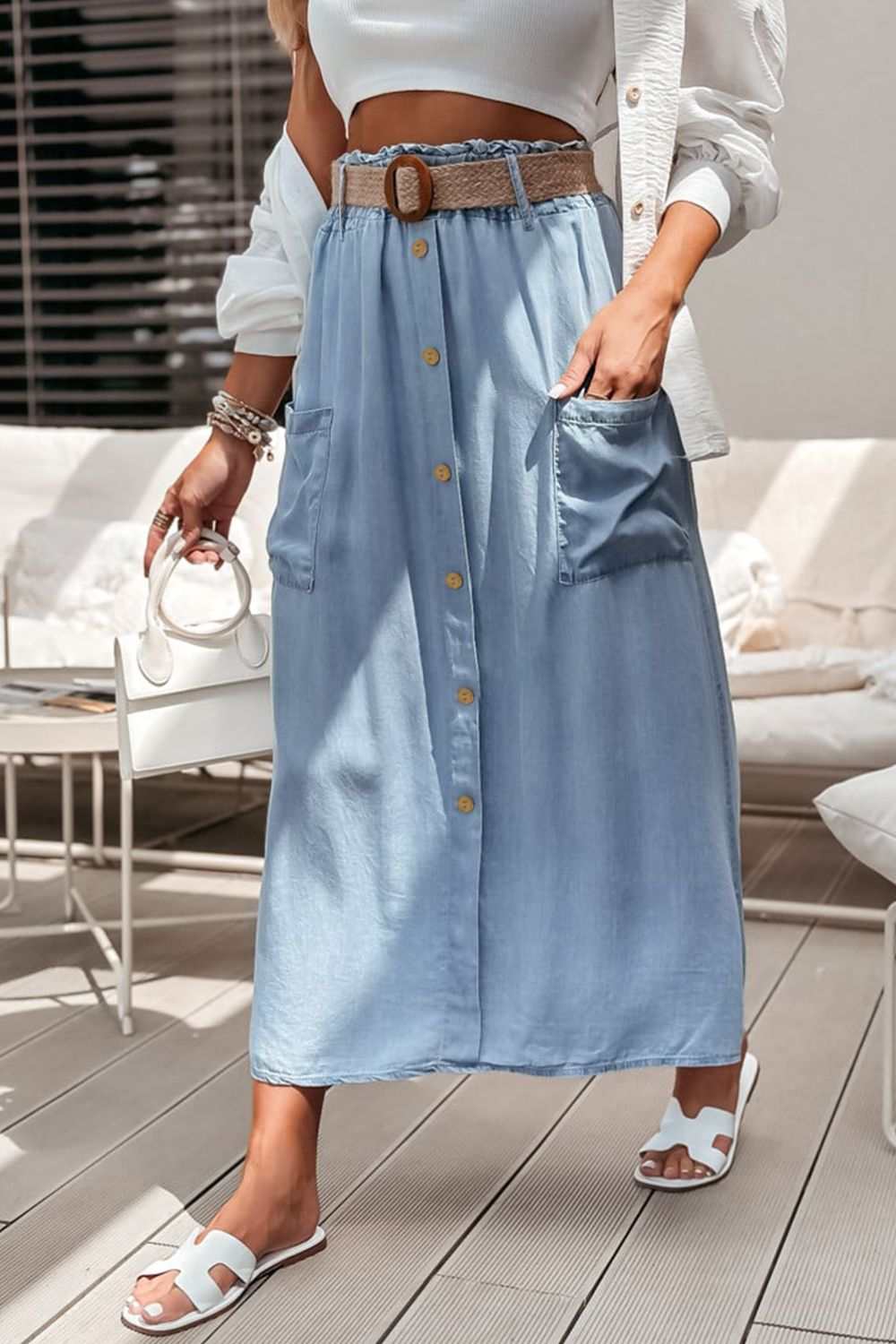Frill midi skirt with buttoned front and pockets in light blue.