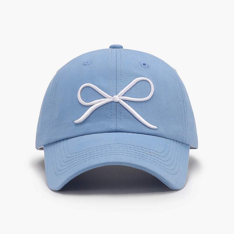 Bow Embroidered Cotton Baseball Cap in blue with a white bow design on the front.