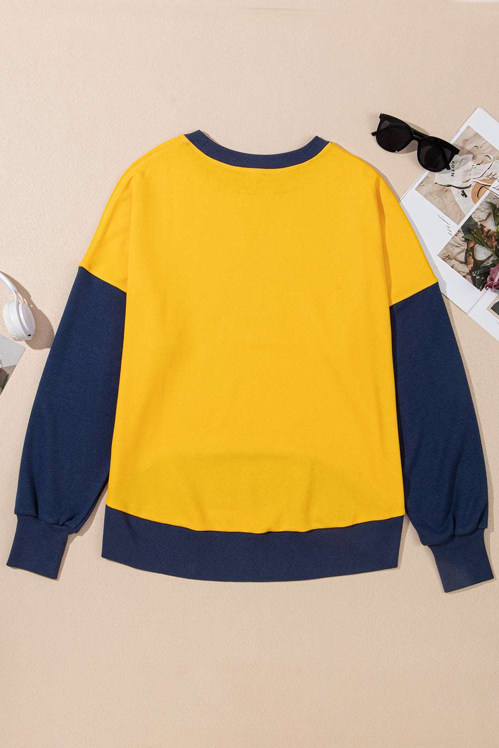Contrast round neck long sleeve sweatshirt in yellow and navy colorblock design.